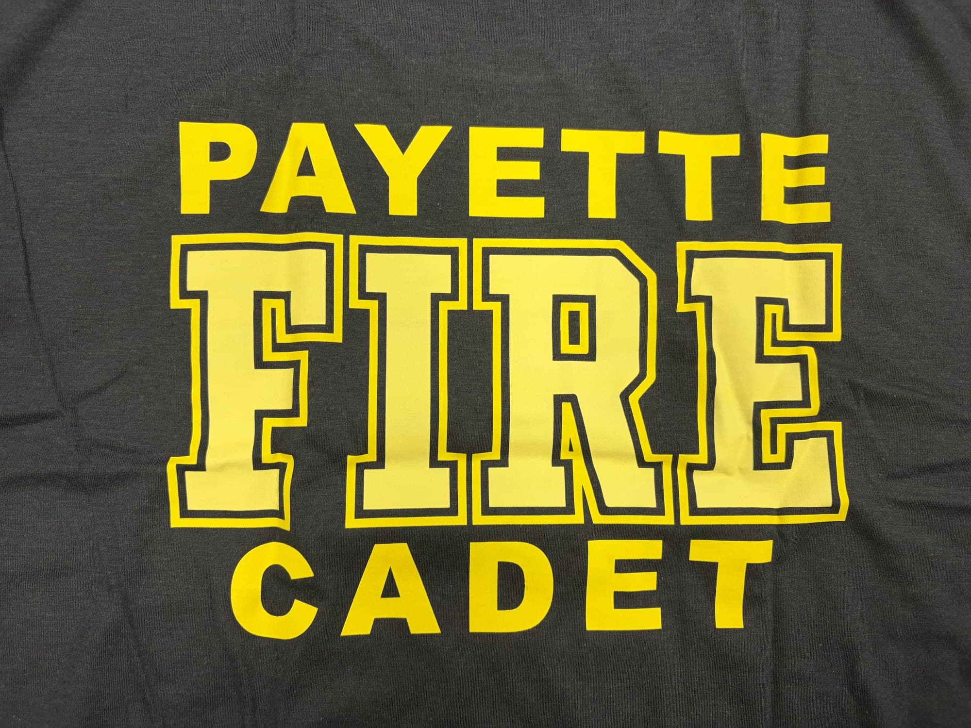 The back of a Payette Fire Cadet shirt, lettered PAYETTE FIRE CADET in yellow